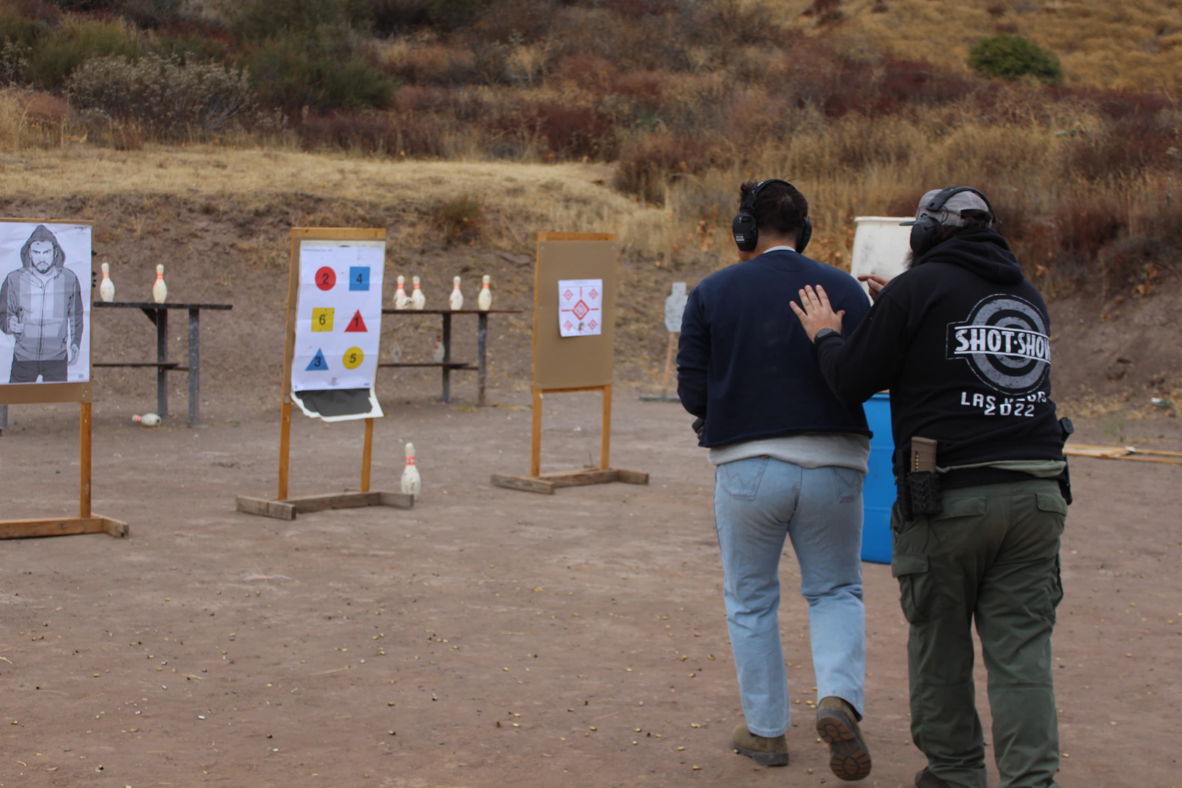 A CTI student is participating in a Moving-While-Shooting drill, with a CTI instructor directing him